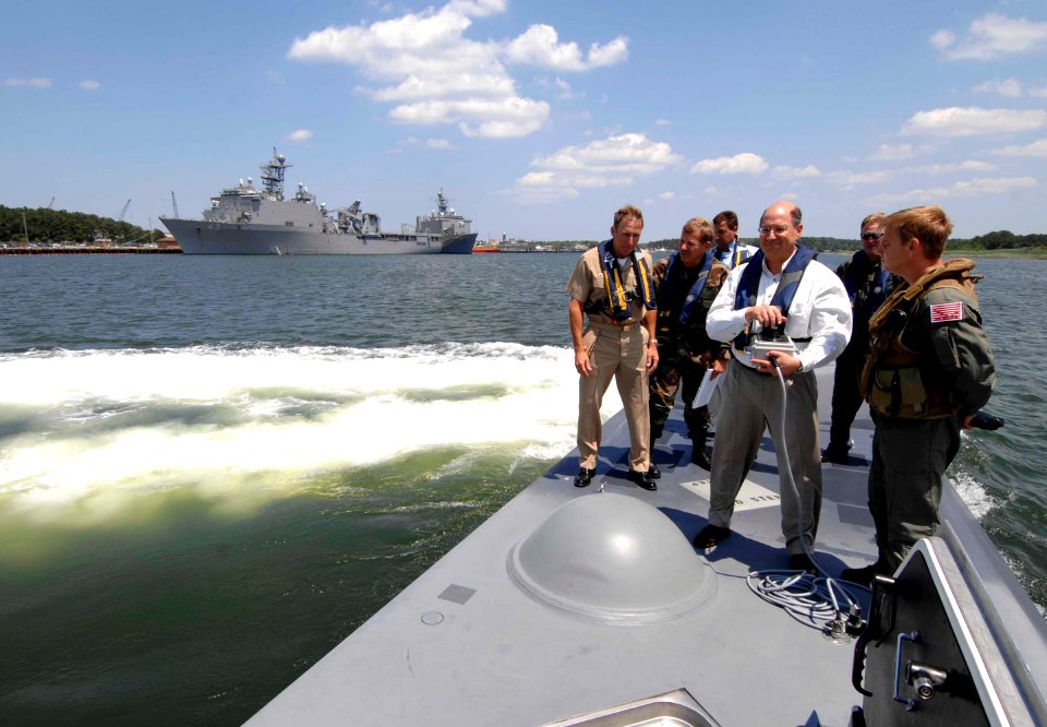 US Navy 070605-N-3642E-229 Secretary of the Navy (SECNAV) The Honorable Dr. Donald C. Winter uses a remote device to bring the SEAL Insertion, Observation and Neutralization (SEALION) craft into port at Naval Amphibious Base Li