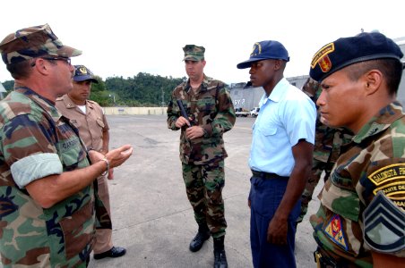 US Navy 070606-N-0989H-064 A Guatemalan sailor conducts a vehicle inspection during port security subject matter exchanges photo