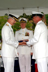 US Navy 070615-N-2147L-003 Force Master Chief Jeff Vandervort, right, presents Vice Adm. James D. McArthur Jr. with his flag
