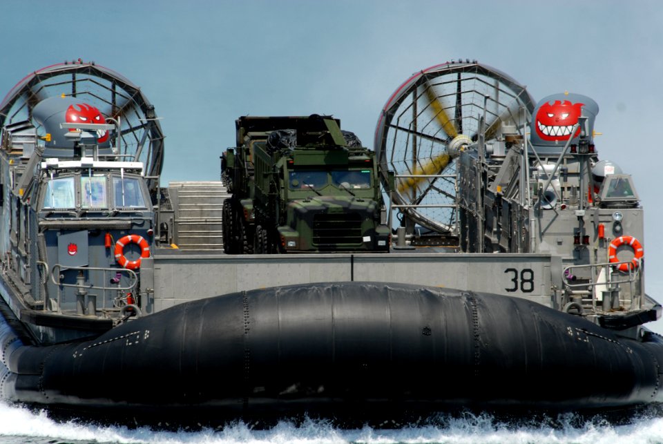 US Navy 070615-N-5033P-112 A landing craft air cushion (LCAC) from Assault Craft Unit (ACU) 4 brings Marine Corps vehicles aboard amphibious assault ship USS Kearsarge (LHD 3) during Kearsarge Expeditionary Strike Group's