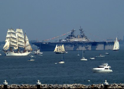 US Navy 070608-N-6854D-003 Small sailboats and ships pass by amphibious assault ship USS Wasp (LHD 1) on the Elizabeth River while in transit to the Norfolk Harbor Fest