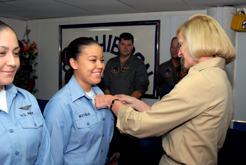 US Navy 070615-N-4124C-008 Air Traffic Controller Airman Alicia M. Wayman, of Tactical Squadron 12, receives her Enlisted Air Warfare Specialist (EAWS) pin from Commander, Expeditionary Strike Group (ESG) 7, Rear Adm. Carol M