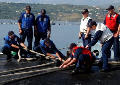 US Navy 070609-N-0780F-006 Crew members conduct mooring operations as Los Angeles-class submarine USS Scranton (SSN 756) arrives for a routine port visit photo