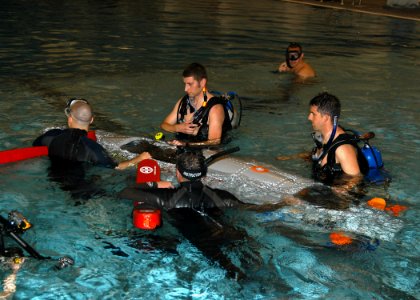 US Navy 070613-N-6247M-019 Sailors from Naval Air Station Whidbey Island's Aviation Survival Training Center (ASTC) and students from Everett Community College test a small submarine