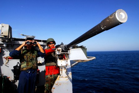 US Navy 070607-N-6326B-014 Aviation Ordnanceman 3rd Class Christopher Nez and Jonathan Bellamy stand watch on the flight deck of nuclear-powered aircraft carrier USS Nimitz (CVN 68)