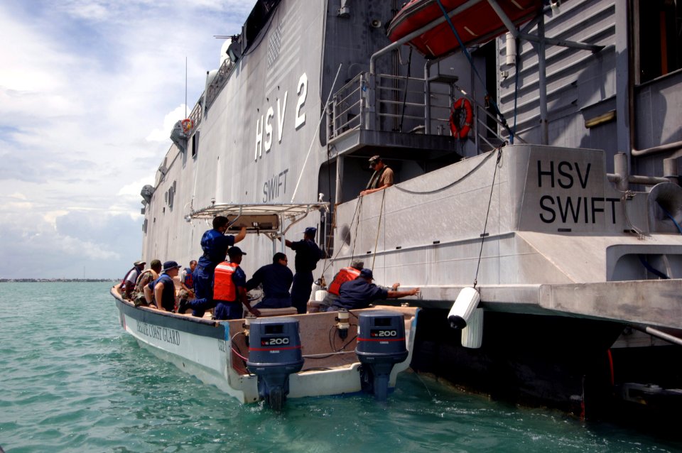 US Navy 070611-N-0989H-024 U.S. service members from the Expeditionary Training Command and Coast Guard International Training Division conduct a vessel assessment aboard a Belizean Coast Guard boat
