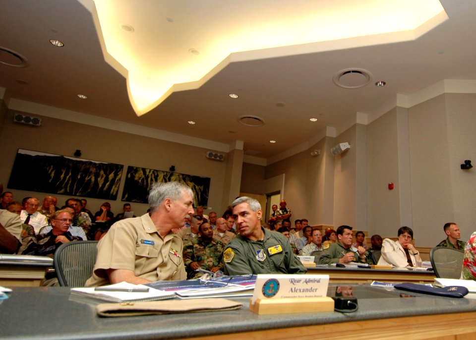 US Navy 070618-N-0879R-001 Rear Adm. T. G. Alexander, commander, Navy Region Hawaii, and Hickam Air Force Base Commander, Col. J. J. Torres discuss some of the points made during the Joint Base Pearl Harbor-Hickam Table Top Exe
