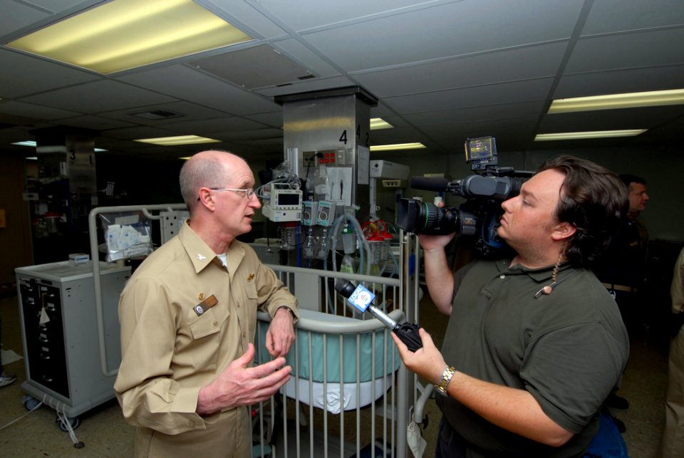 US Navy 070617-N-8704K-136 Brian Ely, of WPLG Channel 10 Miami, interviews Capt. Bruce Boynton, commanding officer of the Medical Treatment Facility aboard the Military Sealift Command hospital ship USNS Comfort (T-AH 20)