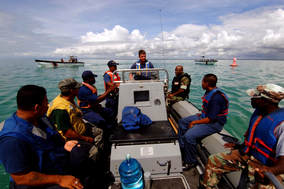 US Navy 070613-N-0989H-007 Chief Boatswain's Mate William Partington conducts small boat operations subject matter exchanges with personnel from the Belize National Coast Guard, Belize Defense Force and the Belize Police Force