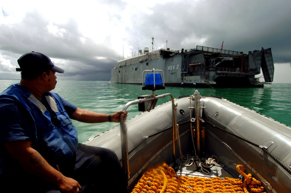 US Navy 070613-N-0989H-024 Chief Boatswain's Mate William Partington from the U.S. Coast Guard International Training Division conducts small boat operations subject matter exchanges with personnel from the Belize National Coas