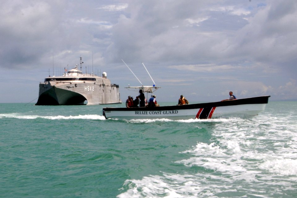 US Navy 070611-N-0989H-032 U.S. service members from the Expeditionary Training Command and Coast Guard International Training Division conduct a vessel assessment aboard a Belizean Coast Guard boat