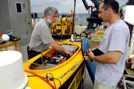 US Navy 070612-N-7676W-147 Gene Latham, left, and Joseph Curcio from the Massachusetts Institute of Technology, prepare Scout, an autonomous surface platform, for deployment as part of Autonomous Underwater Vehicle (AUV) Fest 2