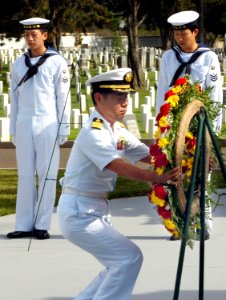 US Navy 070613-N-4163T-010 Captain Takanari Murata, commander, Escort Division 4 Japan Maritime Self-Defense Force (JMSDF), places a wreath on its stand during a wreath-laying ceremony at Fort Rosecrans National Cemetery