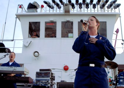 US Navy 070617-N-4238B-033 Musician 3rd Class Rachel Lucterhand and keyboard player Musician 1st Class Michael Wells, members of the Navy Showband aboard the Military Sealift Command (MSC) hospital ship USNS Comfort (T-AH 20)