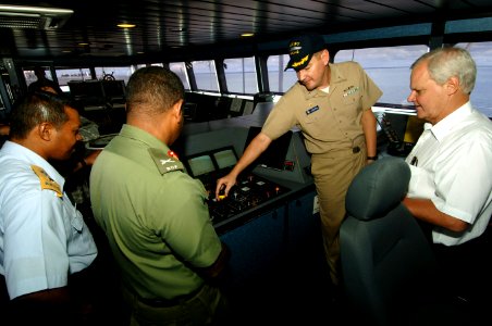 US Navy 070614-N-0989H-043 Cmdr. Charles Rock, commanding officer of High Speed Vessel (HSV) 2 Swift, gives a tour of the ship's bridge to the Honorable Robert Dieter, U.S. Ambassador to Belize, Brig. Gen. Lloyd Gillett, Comman photo