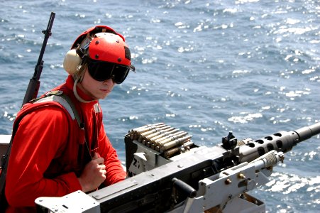 US Navy 070613-N-0890S-034 Aviation Ordnanceman Airman Timothy Fennell stands watch aboard the nuclear-powered aircraft carrier USS Nimitz (CVN 68)