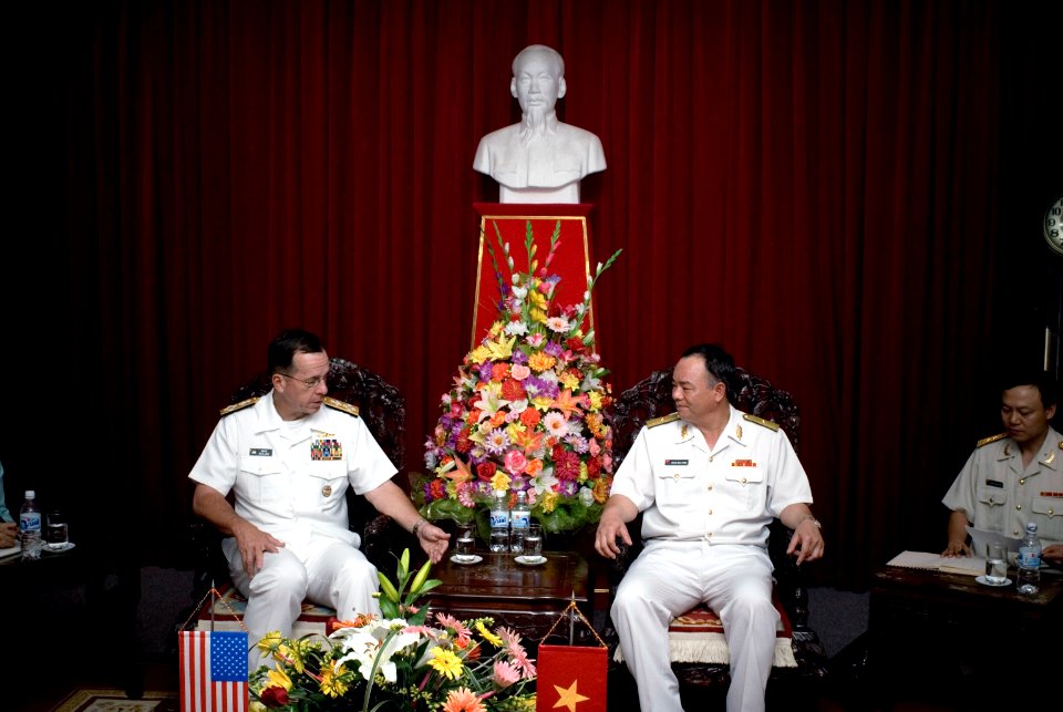 US Navy 070620-N-0696M-458 Chief of Naval Operations (CNO) Adm. Mike Mullen speaks with Vietnamese People's Navy Vice Adm. Pham Ncoc Phin during an office call