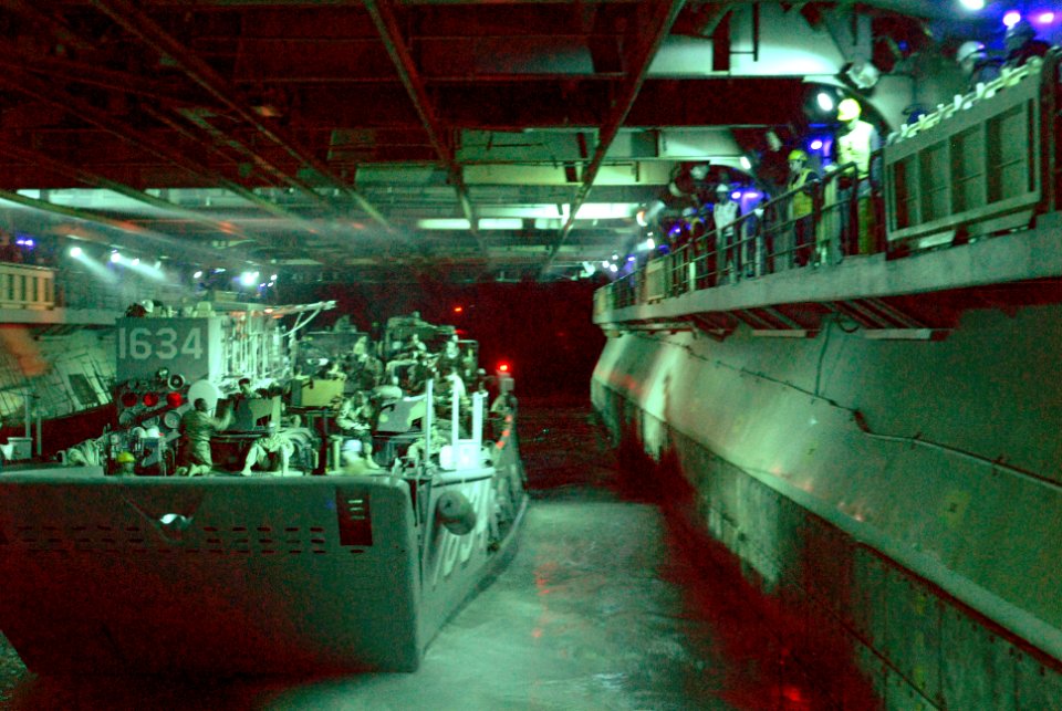 US Navy 070620-N-4010S-058 Sailors from USS Essex (LHD 2) and Assault Craft Unit 1 depart with a load of Marines and their equipment during a nighttime beach assault at Shoalwater Bay Training Area