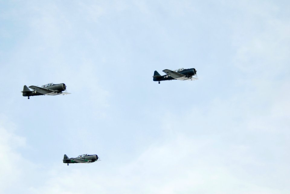 US Navy 070620-N-1688B-244 Vintage aircraft fly in formation during an air show at Virginia Beach Airport to commemorate the World War II Battle of Midway