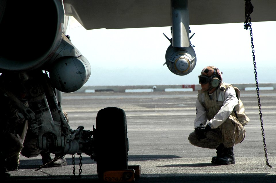 US Navy 070615-N-0890S-010 Staff Sgt. Dennis Hunt performs a pre-flight inspection on an F-A-18A Hornet aboard nuclear-powered aircraft carrier USS Nimitz (CVN 68)