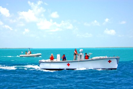 US Navy 070620-N-8704K-013 Civilian mariners operate a lifeboat used to transport crew and patients from the Military Sealift Command hospital ship USNS Comfort (T-AH 20) to Belize City, Belize
