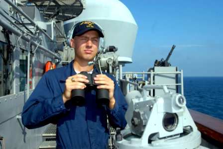 US Navy 070621-N-0841E-031 Boatswain's Mate Seaman Jarett Strickland assigned to deck department stands watch on board guided-missile cruiser USS Vicksburg (CG 69)