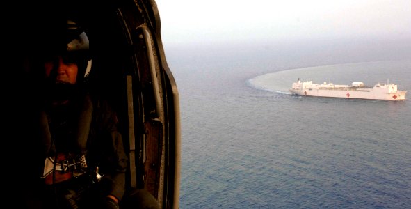 US Navy 070618-N-6278K-056 Aviation Warfare Systems Operator 1st Class Carlos Hernandez takes off in an MH-60S Seahawk