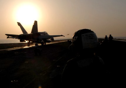 US Navy 070623-N-3729H-341 An F-A-18C Hornet, from the Death Rattlers of Marine Strike Fighter Squadron (VMFA) 323, launches off the flight deck of Nimitz-class aircraft carrier USS John C. Stennis (CVN 74)