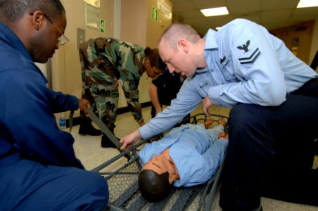 US Navy 070621-N-0194K-003 Hospital Corpsman 2nd Class Samuel Hutcheson conducts stretcher bearer training aboard Military Sealift Command hospital ship USNS Comfort (T-AH 20)