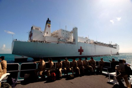 US Navy 070621-N-8704K-025 U.S. military members transit on a catamaran boat used to transport crew and patients from the anchored Military Sealift Command hospital ship USNS Comfort (T-AH 20) to Belize