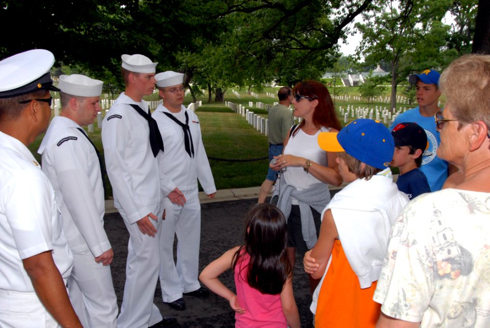 US Navy 070620-N-6724S-068 Four Sailors from Precommissioning Unit (PCU) George H.W. Bush (CVN 77) talk with visitors to Arlington National Cemetery