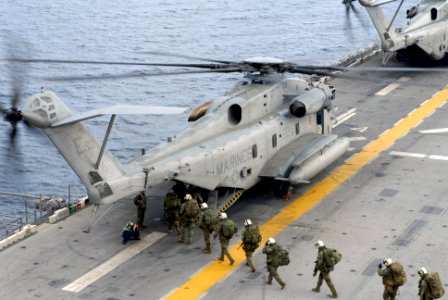 US Navy 070619-N-4010S-032 Marines assigned to 3rd Marine Expeditionary Brigade prepare to load into a CH-53E Super Stallion, attached to the Marine Medium Helicopter Squadron (HMM) 265 photo