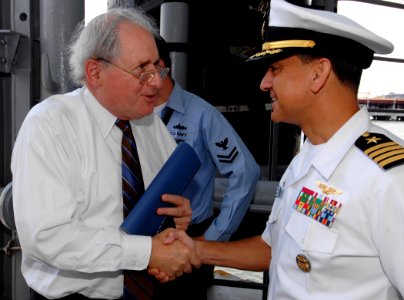 US Navy 070624-N-5345W-002 USS Harry S. Truman (CVN 75) Commanding Officer, Capt. Herman Shelanski, right, welcomes aboard Michigan Senator Carl Levin (D), Chairman of the Senate Armed Services Committee, as he arrives to serve