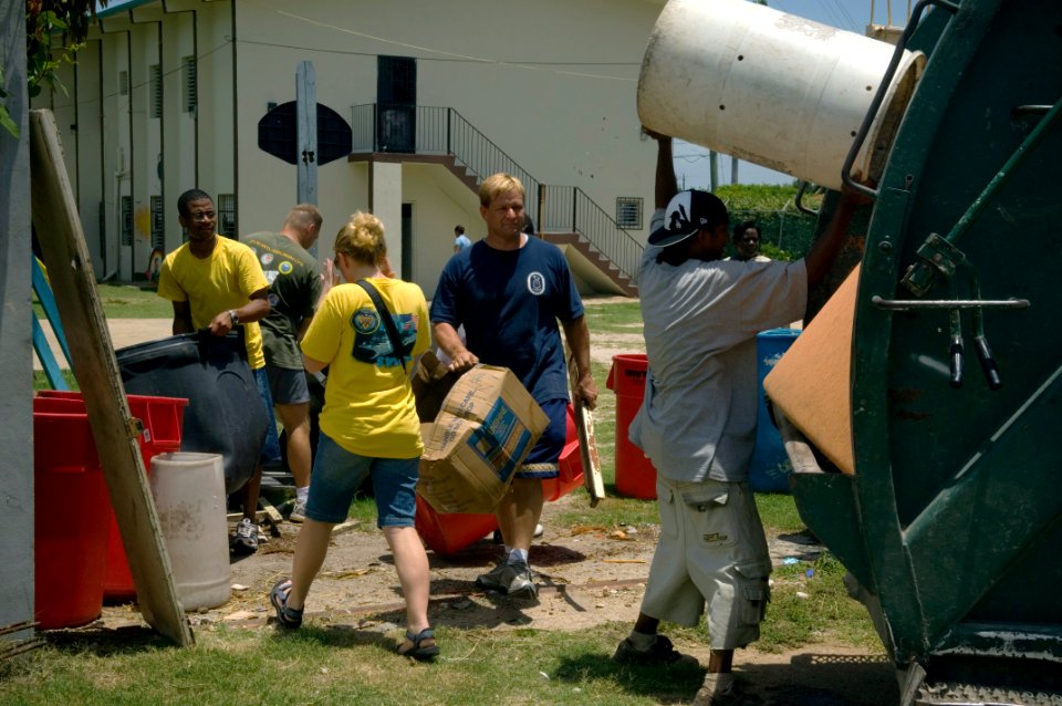 US Navy 070620-N-5319A-001 Members of High Speed Vessel (HSV) 2 Swift throw away trash while making repairs and helping cleaning up an orphanage in Belize. Task Group 40.9 is deployed as part of the pilot Global Fleet Station (