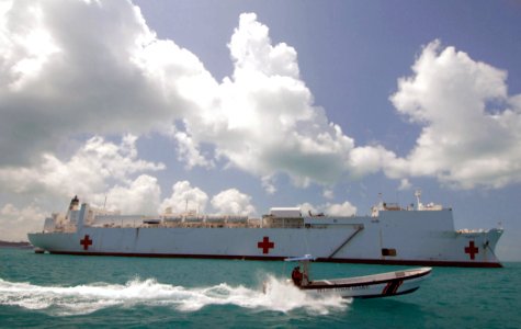 US Navy 070621-N-8704K-138 The Belize coast guard provides security support for the anchored Military Sealift Command hospital ship USNS Comfort (T-AH 20) during a scheduled stop off the coast of Belize