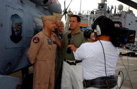 US Navy 070622-N-1810F-008 Lt. Cmdr. Juan Gutierrez, assigned to Helicopter Antisubmarine Squadron Light (HSL) 46, talks to Fox & Friends co-host Brian Kilmeade about the SH-60 Seahawk