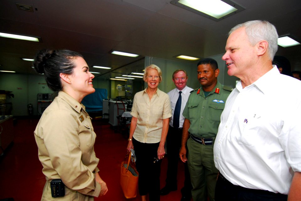 US Navy 070625-N-6081J-001 U.S. Ambassador to Belize, The Honorable Dr. Robert J. Dieter, speaks with Lt. j.g. Melissa McMurry, a Navy nurses corps officer, during a guided tour of the Military Sealift Command hospital ship USN