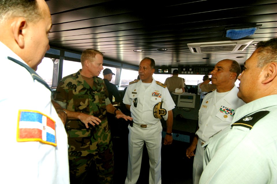 US Navy 070624-N-0989H-079 Capt. Douglas Wied, commander, Task Group 40.9, gives Valm Julio Cesar Ventura Bayonet, Valm Ivam Pena Castillo of the Dominican Republic Navy a tour of High Speed Vessel (HSV) 2 Swift