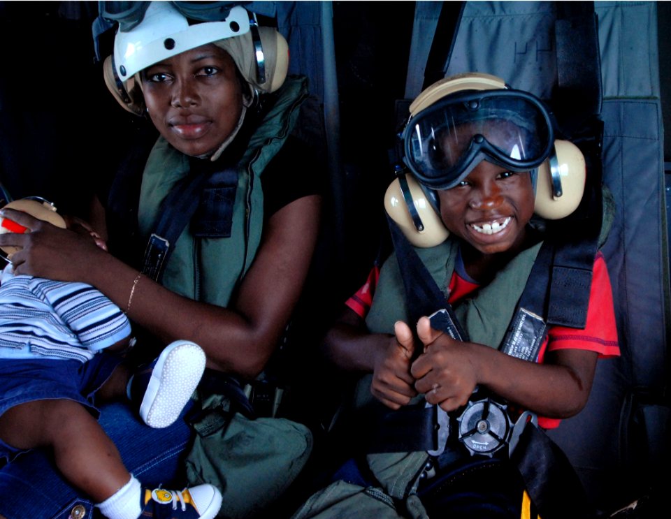 US Navy 070622-N-4238B-230 A child gives the thumbs up to the camera while in transit to Military Sealift Command (MSC) hospital ship USNS Comfort (T-AH 20)