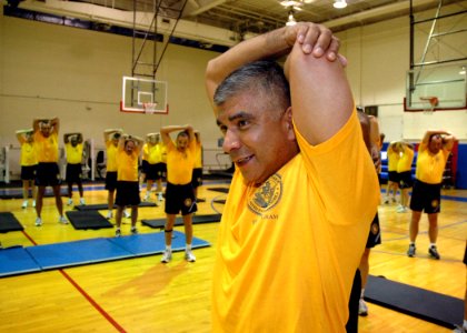 US Navy 070627-N-1328C-033 Master Chief Petty Officer of the Navy (MCPON) Joe R. Campa Jr., and naval personnel attending MCPON's Leadership Mess Meeting, stretches prior to a morning work out photo