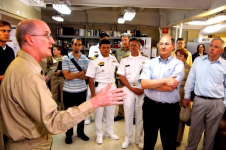 US Navy 070627-N-0194K-078 Commanding Officer, Medical Treatment Facility, Capt. Bruce Boynton speaks with Secretary of the Navy (SEVNAV) The Honorable Donald C. Winter and other distinguished guests aboard Military Sealift Com