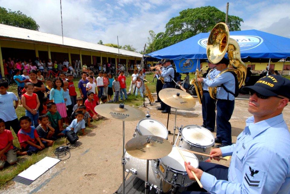 US Navy 070623-N-8704K-048 The U.S. Navy Showband, attached to the Military Sealift Command hospital ship USNS Comfort (T-AH 20), performs for children at the Monsignor Romero Roman Catholic School
