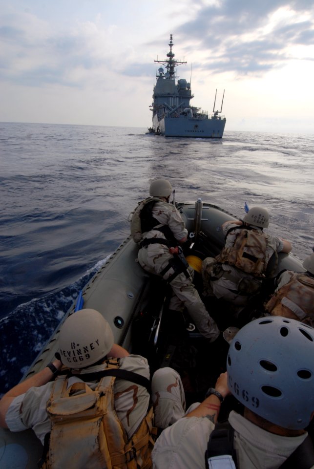 US Navy 070624-N-0841E-111 Members assigned to the visit, board, search and seizure (VBSS) team on board guided-missile cruiser USS Vicksburg (CG 69) take part in a boarding scenario training exercise