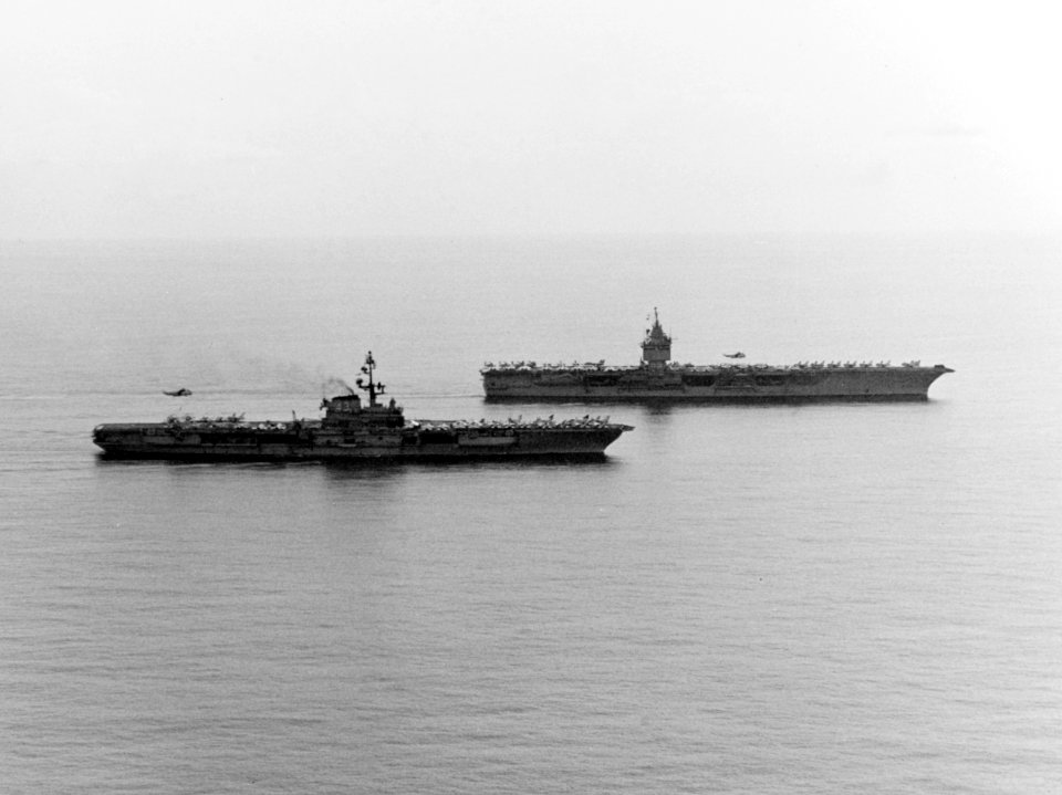 USS Coral Sea (CVA-43) and USS Enterprise (CVAN-65) steam together in the South China Sea on 20 April 1975
