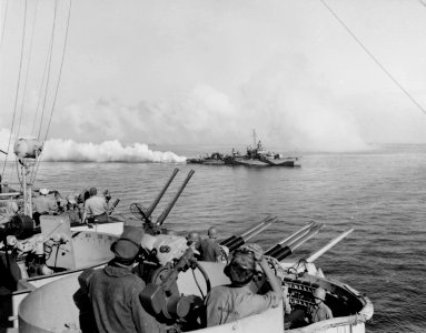 USS Cony (DD-508) lays a smoke screen off Leyte on 20 October 1944 (80-G-289679)