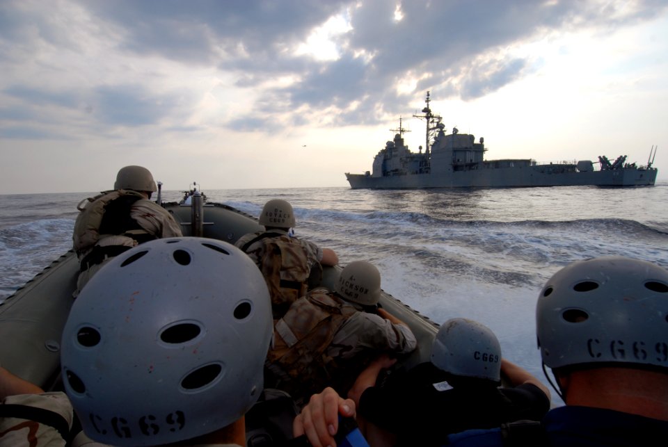 US Navy 070624-N-0841E-138 Members assigned to the visit, board, search and seizure (VBSS) team on board guided-missile cruiser USS Vicksburg (CG 69) take part in a boarding scenario training exercise