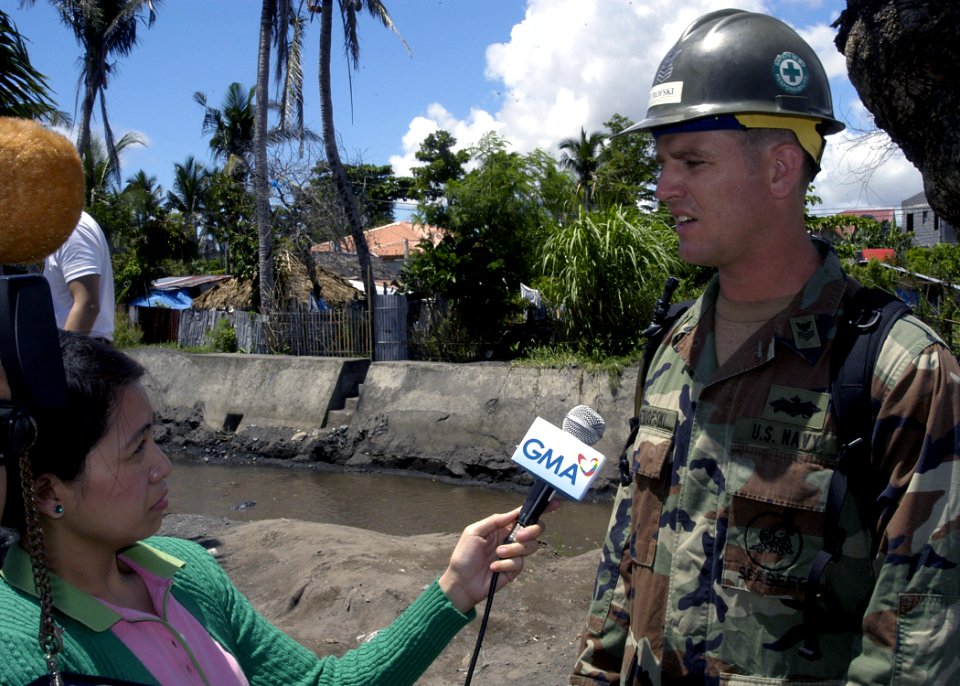 US Navy 070628-N-1752H-048 Equipment Operator 1st Class George Petrofski attached to Naval Mobile Construction Battalion (NMCB) 7 answers questions from the local media about what the Navy is doing in support of the Pacific Pa