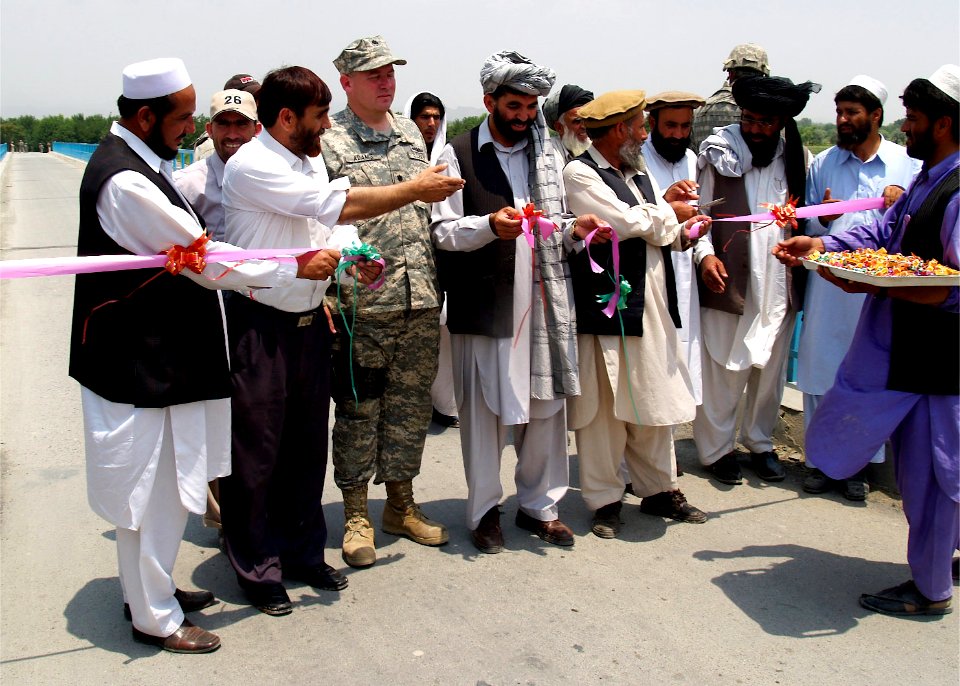 US Navy 070624-N-3385W-015 Commanding Officer of Provincial Reconstruction Team Khost, Navy Cmdr. David Adams and the Deputy Governor of Khost Province Ajab Khan Sangin re-open the Shamal bridge