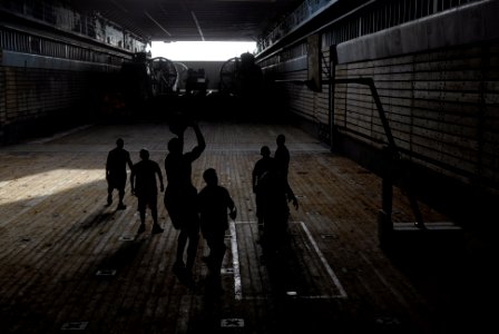 US Navy 070628-N-7498L-065 Sailors play basketball in the well deck aboard dock landing ship USS Rushmore (LSD 47)