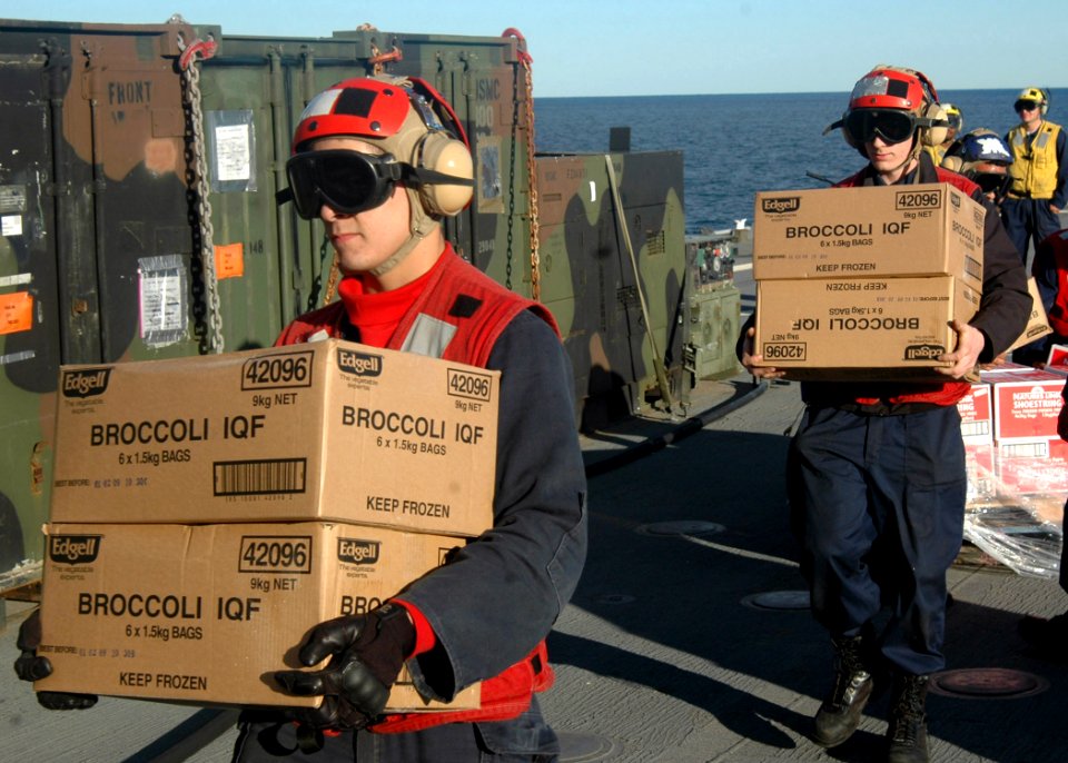 US Navy 070628-N-6710M-008 Members assigned to the flight deck aboard USS Tortuga (LSD 46), transit supplies while underway in support Talisman Saber 07 (TS 07)